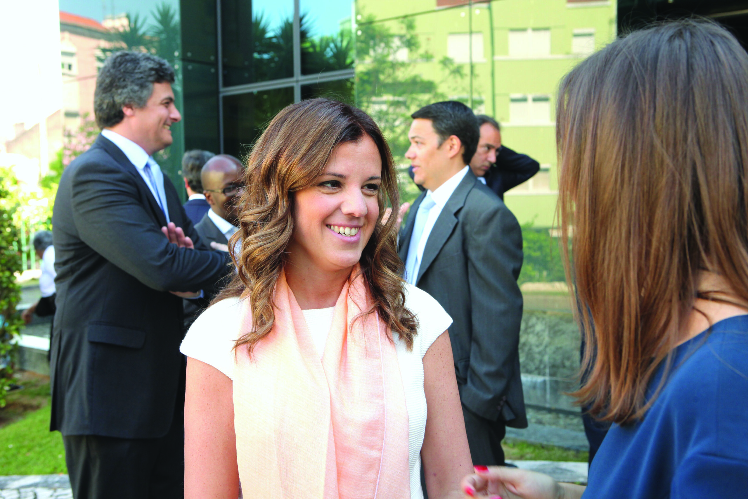 a woman smiling at another woman
